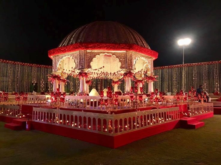 Rigveda Palace luxury outdoor garden wedding farmhouse and best wedding venue in Faridabad with elegant banquet hall and lush green lawn.